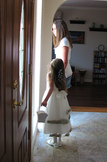 Heather helps Lizzie get ready for the procession.