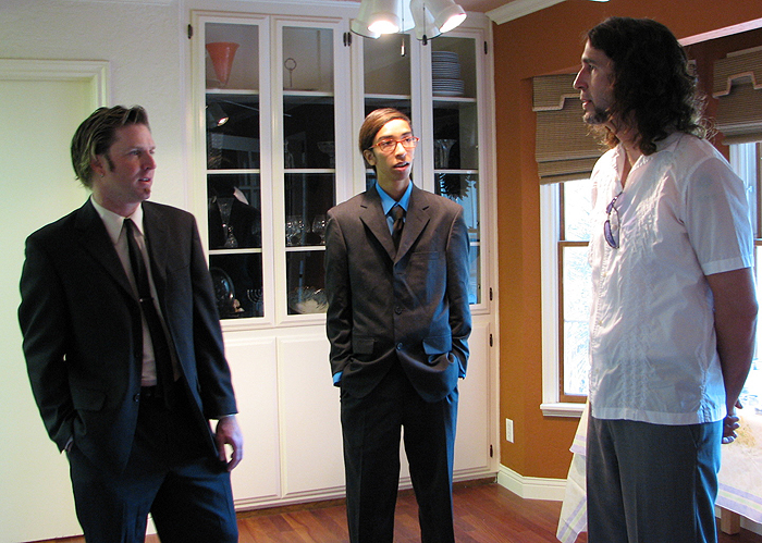 Jim's brother Jeff (from left), nephew Alex and brother-in-law George chat before the ceremony.