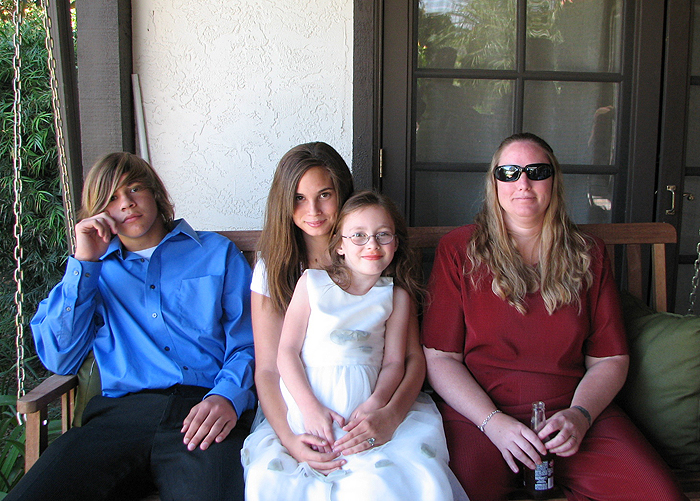 Elizabeth sitting with her cousins Ryne and Heather and her Aunt Michelle.