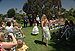 Elizabeth and Larissa walk toward the waiting groom.